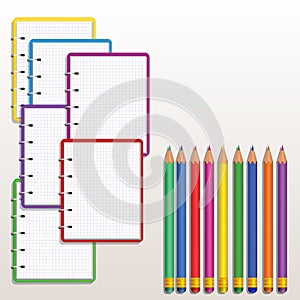 Set of realistic colorful spiral notebook with blank squared paper pages and row of color pencils isolated on white background. De