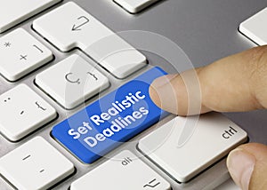 Set Realistic Deadlines - Inscription on Blue Keyboard Key