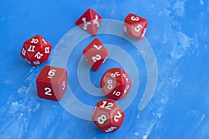Set of red dices for rpg, board games, tabletop games or dnd on blue background