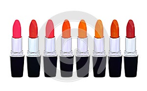 Set of red lipsticks isolated on white reflective