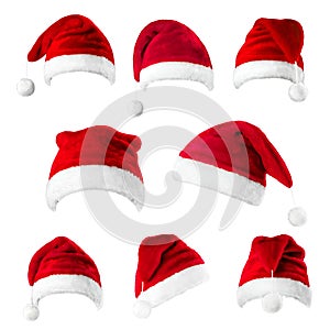 Set of red Santa Claus hats isolated on white background