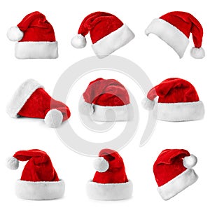 Set of red Santa Claus hats on white