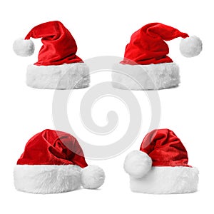 Set of red Santa Claus hats on white