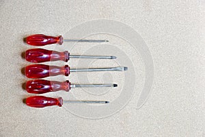 A set of red divers on a wooden background
