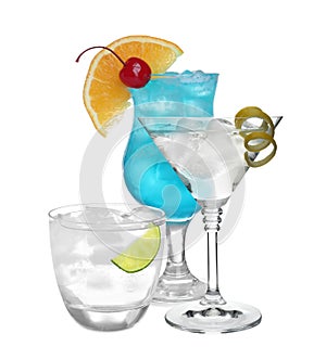 Set of refreshing alcoholic drinks on background