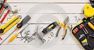 Set of repair tools on white  wooden background