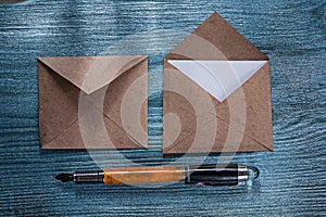 Set of retro post envelopes fountain pen on wooden board