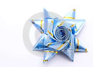 Set ribbon folded into a flower. Wrap coins by hand. For the sac