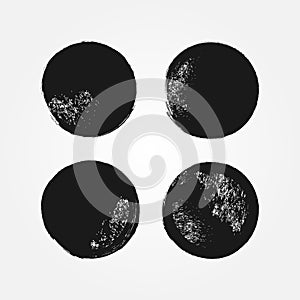 Set of round grunge textures. Damaged black backgrounds drawn with a brush.