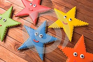 A set of royal icing gingerbread smile stars cookies
