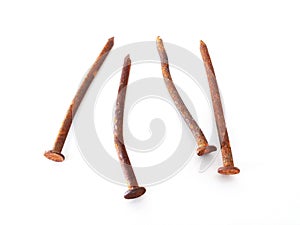 Set of rusty nails on white background. Close up of Bunch of old wry rusty nails shot from above on white. Hardware items