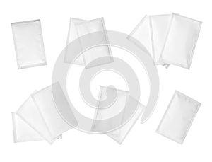 Set with sachets of medicine on white background, top view