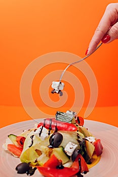 Set of salads on a dark background. Greek salad, Caesar salad, vegetable salad.