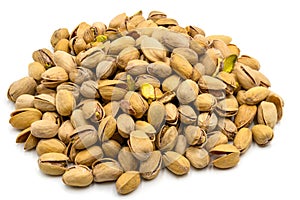 A set of salted and roasted pistachio seeds on a white background. Perfect shot for vegan diet, wellness and healthy eating