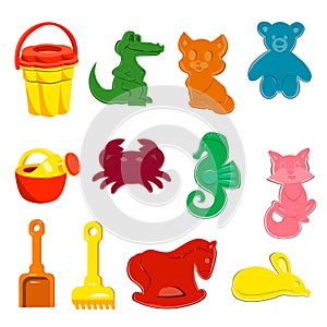 A set of sand toys. Animal molds, bucket, watering can, shovel, rake, toys for children