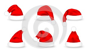 Set of Santa Claus hats. Realistic red Santa Claus caps on white background. Cute Christmas Santa hat