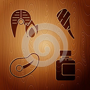 Set Sauce bottle, Grilled fish steak and fire flame, Steak meat and Rib eye steak on wooden background. Vector