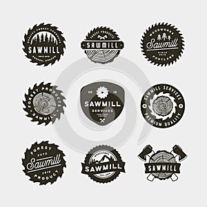 Set of sawmill logos. retro styled woodwork emblems. vector illustration photo