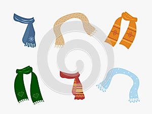 A set of scarves in different shapes and colors for cold weather. Stylish scarves on a white background. Clothes for