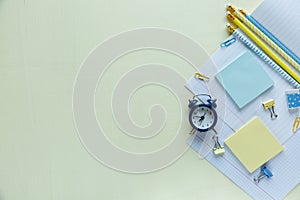 Set of school stationery back to school: pencils, clock, notepad, ruler on yellow background. education, lesson