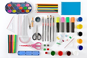 Set of school supplies on white background. Paint, pencils, note