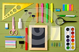 Set of school supplies on wooden table background, creative layout made of stationery. Education, studying and back to school