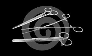 Set of scissors isolated in gray steel black background