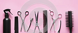 Set with scissors and other hairdresser`s accessories on pink background, flat lay. Banner design