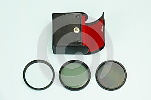 Set of screw-on photographic glass filters and a case for safe storage and carrying
