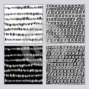 A set of seamless abstract monochrome patterns. Black and white print with wavy lines, dots and spots. Brush strokes are hand-