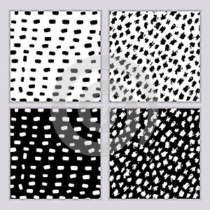 A set of seamless abstract monochrome patterns. Black and white print with wavy lines, dots and spots. Brush strokes are hand-