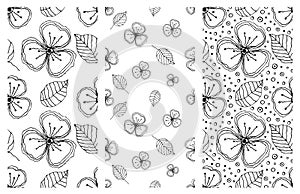 Set of seamless vector floral patterns. Black and white hand drawn background with flowers, leaves, decorative elements. Graphic i