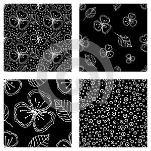 Set of seamless vector floral patterns. Black and white hand drawn background with flowers, leaves, decorative elements. Graphic i