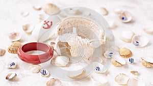 Set of seashells and plastic bracelets in a nautical style, summer jewelry, top view, summer vacation concept