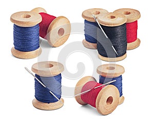 Set of sewing needle and colorful sewing threads on wooden spool on isolated white background