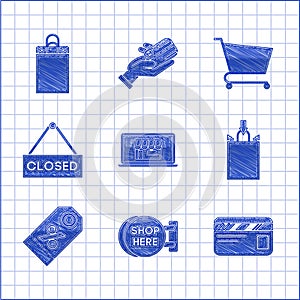 Set Shopping building on screen laptop, Signboard hanging with an inscription shop here, Credit card, Paper shopping bag