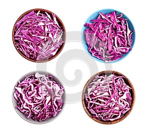 Set of shredded fresh red cabbage in bowls on white background, top view