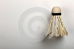 Set shuttlecock on grey, feather volant for badminton game, close-up. Copyspace, textspace.