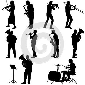 Set silhouette of musician playing the trombone, drummer, tuba, trumpet, saxophone, on a white background photo