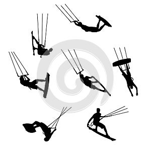 Set of silhouettes of kitesurfers, kiteboarding, watersports.