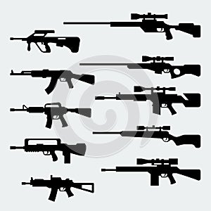 Silhouettes of modern assault and sniper rifles photo