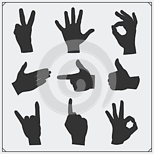 Set of silhouettes of people hands. Different gestures.