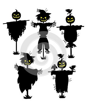 A set of silhouettes of scarecrows. Collection of black silhouettes stuffed with pumpkin head. Set for Halloween. Mystic