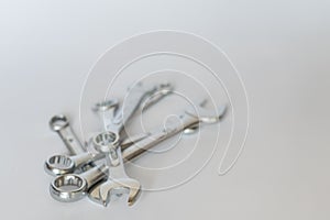 Set of silver metallic spanners, isolated objects.