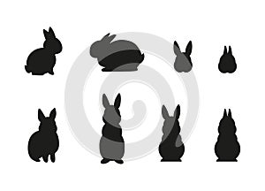 Set of simple black different rabbit silhouettes isolated on white background. - Vector