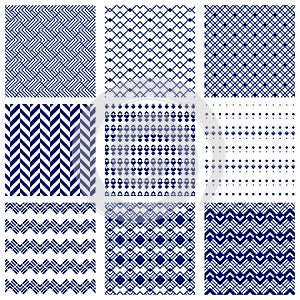 Set of simple geometrical seamless patterns in navy blue and white colors.