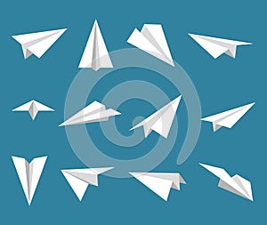 Set simple paper planes icon. White origami paper airplanes from different angles. Handmade aircraft on blue background