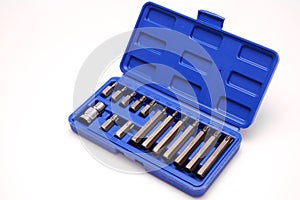 A set of single-sided chrome steel bits in a blue plastic box