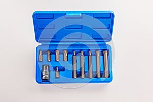 A set of single-sided chrome steel bits in a blue plastic box