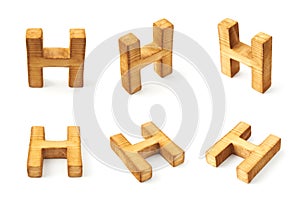 Set of six block wooden letters isolated